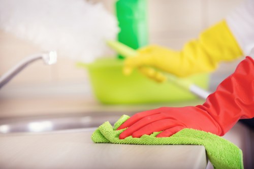 Professional carpet cleaner working safely in a Kentishtown property